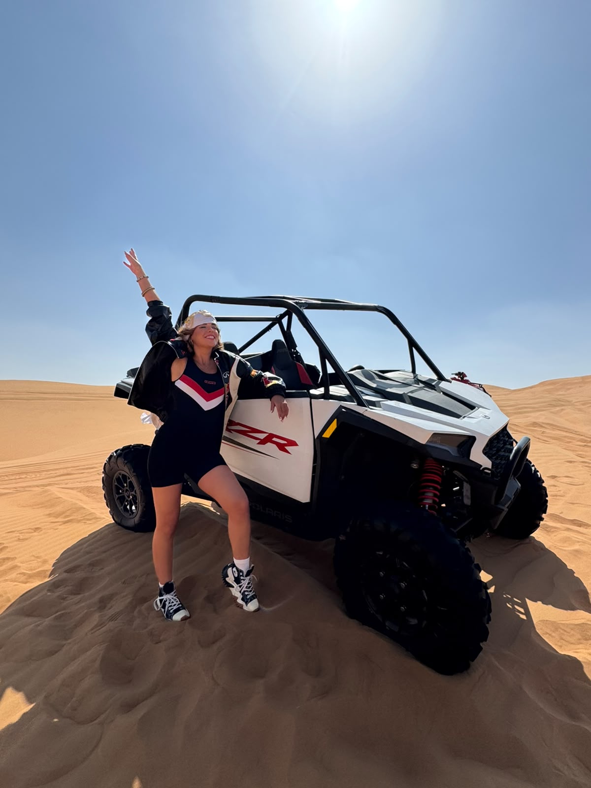 Polaris RZR 1000 dune buggy in the Lahbab dunes