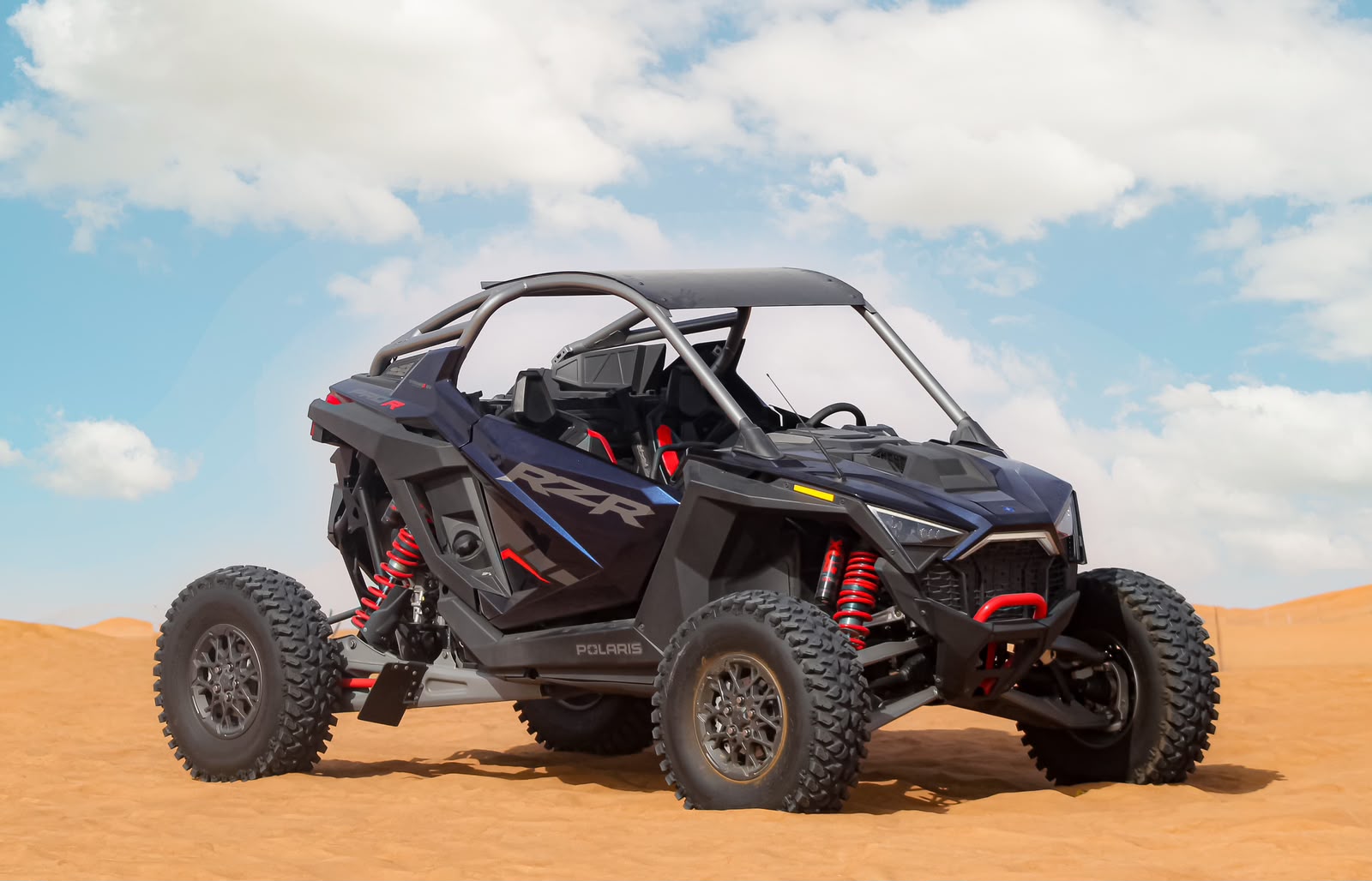 Polaris RZR 2000 dune buggy in the Lahbab dunes